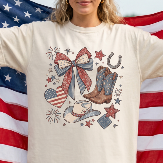 Person wearing a t-shirt with a patriotic design in front of an American flag