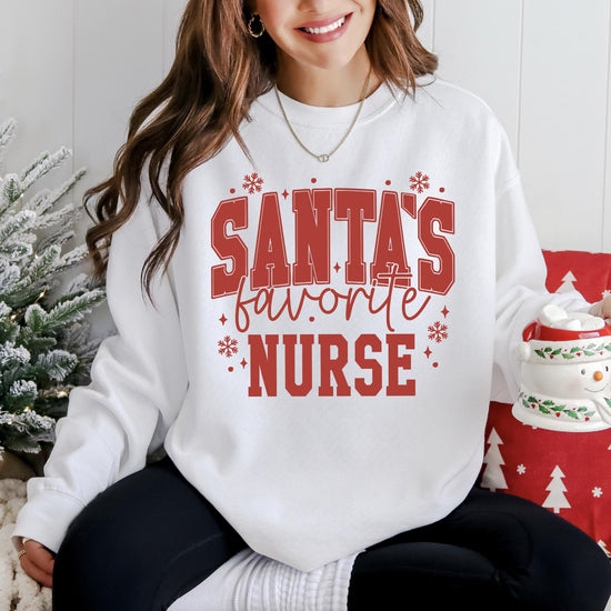 Santa's Favorite Nurse DTG Printed Christmas Sweatshirt or T-Shirt | Cute Holiday Graphic Tee | Pink Christmas Shirt